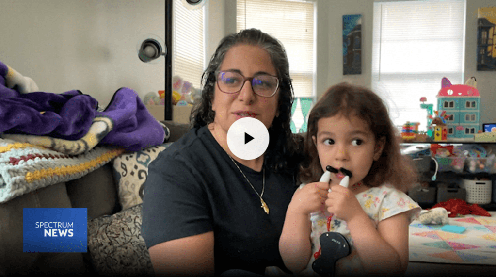Shereen Naser sits with her daughter